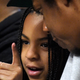 Jay-Z, right, sits with his daughter Blue Ivy during the second half of an NBA basketball game between the Los Angeles and the Los Angeles Lakers Sunday, March 8, 2020.